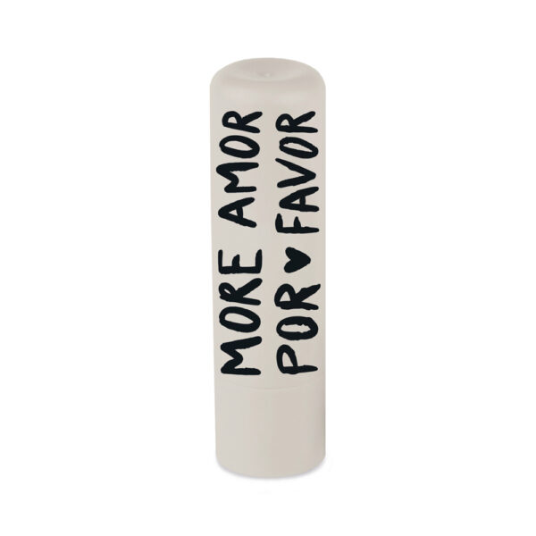 Grafikwerkstatt Lippenpflege-Stift More Amor Por Favor, cremeweißer Stift mit schwarzer Schrift, freigestellt